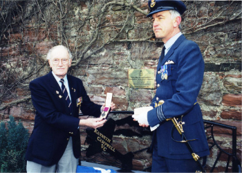 Dedication of the Kenneth Campbell Memorial Garden in 2000, with Ron Bramley who flew with Kenneth on the 1941 raid and Wing Commander David Simpson of 22 Squadron; displaying Kenneth's VC which was gifted to the Squadron.