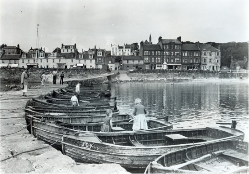 Strathwherry Pier with motor boats for hire.