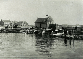 Original changing building of the bathing station, built onto the gable end of the old salt pans ruins.
