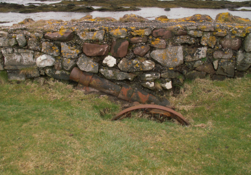 One of the German howitzers built into the sea wall and now being exposed.